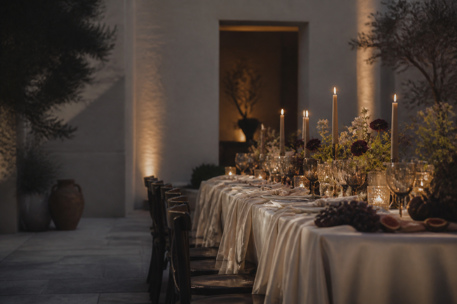 Candlelit tablescape in an elegant courtyard